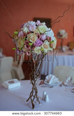 Bouquet Of Flowers On A Leg In The Interior Of The Restaurant For A Celebration Shop Floristry Or We