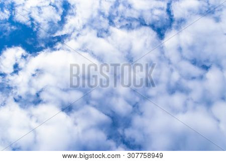 Nature Background. White Clouds Over Blue Sky. Blue Sky With Clouds And Sun.