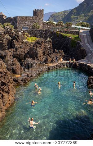 Porto Moniz, Madeira, Portugal - April 18, 2018: Natural Rock Pool Of Porto Moniz On Madeira Island.