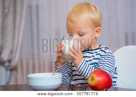 Boy Cute Baby Eating Breakfast. Baby Nutrition. Eat Healthy. Toddler Having Snack. Healthy Nutrition