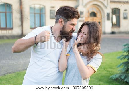 Angry Hipster And Pretty Woman . Relations Problem. Family Crisis Concept. Stop Violence Social Move