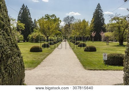 Lednice, Czech Republic - April 22, 2019:tourist In Park Next To Castle Lednice On April 22,2019 In 