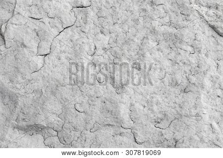 The Texture Of Natural White Granite Stone With Cracks. Background Of Natural Stone Gray. Texture Wi