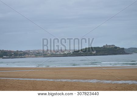 Wide And Long Beach Of Somo In The Bay In Front Of The Palace Of The Magadalena In Santander. August