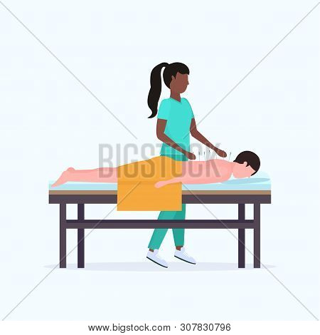 African American Acupuncturist Holding Needle Man Patient Getting Acupuncture Treatment Guy Relaxing