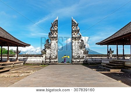 Unidentified Woman At Gate At Pura Lempuyang Luhur With Mr Agung Volcanic View, Sacred Hinduism Temp