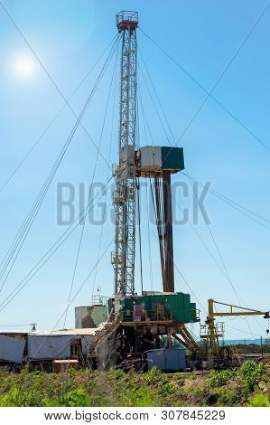 Drilling Rig In Oil Field For Drilled Into Subsurface In Order To Produced Crude. Petroleum Industry