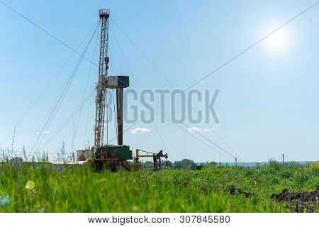 Drilling Rig In Oil Field For Drilled Into Subsurface In Order To Produced Crude. Petroleum Industry