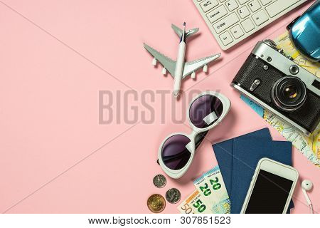 Trip Planning Background. Old Film Camera, Map, Cash Money, Map And Airplane On Pink Background. Top