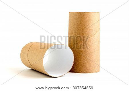Two Cardboard Paper Tubes On White Background. Close-up Of Empty Toilet Rolls