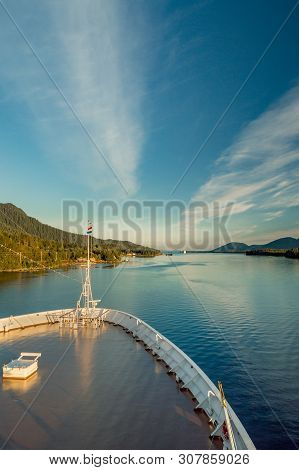 Pointed Bow Of Cruise Ship , Southbound On Ocean Channel, Alaska Inside Passage, In Warm Afternoon S
