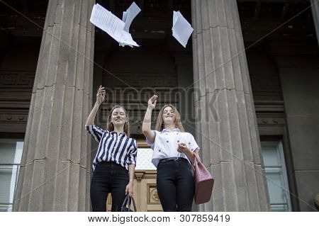 Two Young Happy Students Passed Exams And Leave Home For School, They Run Up The Stairs And Throw Aw