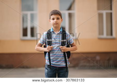 Cute Little Boy With Backpack Go Home After Scholl Class
