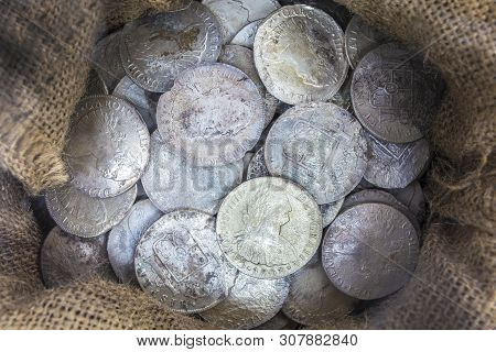 Cartagena, Spain - September 14th, 2018: Sack Full Of Recovered Silver Spanish Coins Recovered From 