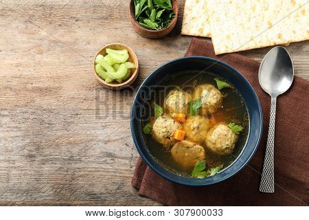 Flat Lay Composition With Jewish Matzoh Balls Soup On Wooden Table. Space For Text