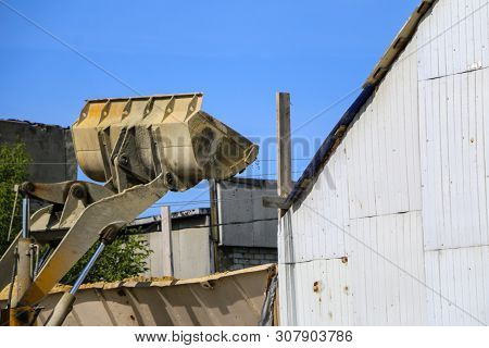 Tractor Collects Scoop With  Gravel. Excavator Extracts Sand And Gravel For  Concrete Mix.