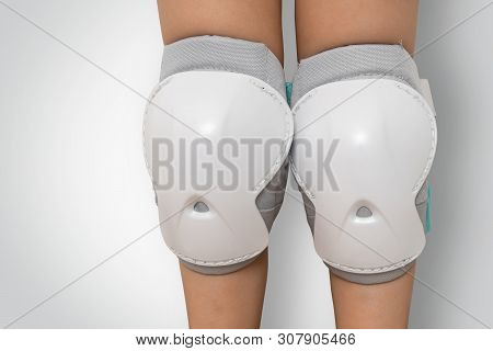 Pair Of Knee Pads Wearing On Legs Of Child