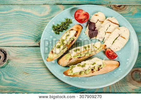Bruschetta With Grilled Cheese Halumi On A Wooden Background. Preparation Of Cheese Halumi. Cheese H