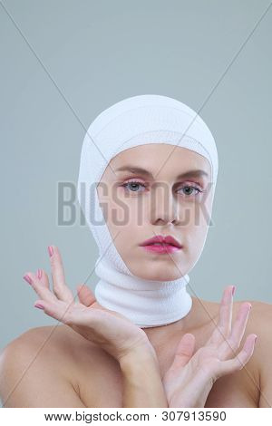 Portrait Of Young Woman Enjoying Her Perfect Beauty After Multiple Plastic Surgeries And Injections