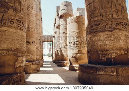 Columns With Hieroglyphs In Karnak Temple At Luxor, Egypt. Travel