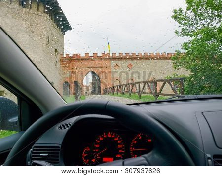 Main Gate Of The Ancient Medzhybizh Fortress Of The 14-16th Centuries, View Through The Car Windshie