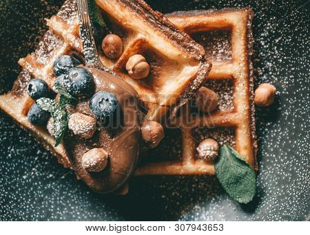Belgian Waffles With Berries, Ice Cream And Chocolate. Breakfast Table Setting. Morning Lifestyle Co