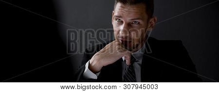 Man In Shadow With Serious Face Staring At Interlocutor, Criminal Interrogation Concept, Panoramic B
