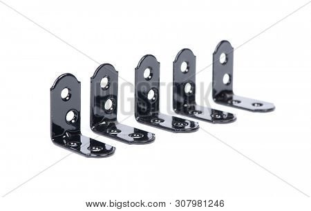 Group of  black metallic angle fixators. Mounting metal angle corners brackets isolated on white background