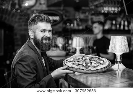 Hipster Client Sit At Bar Counter. Man Received Delicious Pizza. Enjoy Your Meal. Cheat Meal Concept