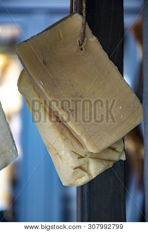 Hand Made From Natural Ingredients And Oils Soap Cutted From Blocks Hanging In Shop Close Up