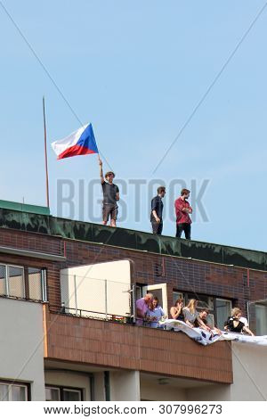 Prague, Czech Republic - June 23 2019: People On A Roof Of A Building Supporting Protests Against Pr