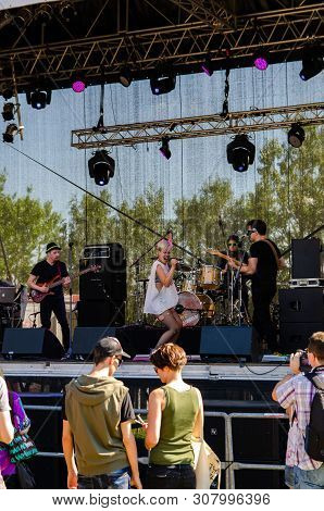 Music Scene On Danube Island. People Gathering To Listen To The Music Band In Vienna Austria