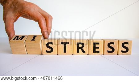 Mistress Or Stress Symbol. Businessman Turns Wooden Cubes And Changes The Word 'mistress' To 'stress