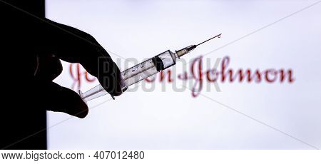 Kathmandu, Nepal - February 7 2021: Syringe Injection Placed Against Johnson And Johnson Logo. Jnj C
