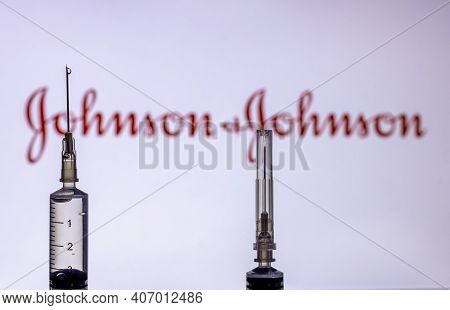 Kathmandu, Nepal - February 7 2021: Syringe Injection Placed Against Johnson And Johnson Logo. Jnj C