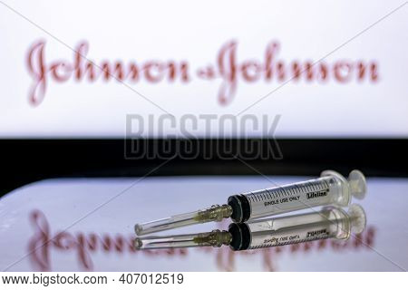 Kathmandu, Nepal - February 7 2021: Syringe Injection Placed Against Johnson And Johnson Logo. Jnj C
