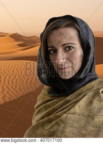 Portrait Of Woman With Hijab And In The Background The Desert