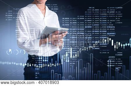 Businesswoman Trader Using Tablet To Update Stock Rates To Forecast Market Behaviour Based On Worldw