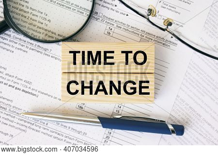 Wooden Blocks With Text Time To Change On Financial Docs