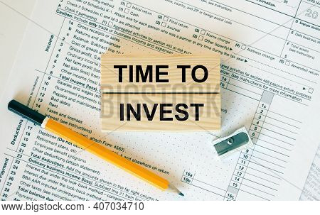 Wooden Blocks With Text Time To Invest On Financial Docs