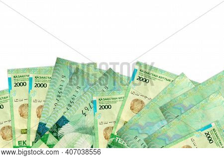 2000 Kazakhstani Tenge Bills Lies On Bottom Side Of Screen Isolated On White Background With Copy Sp