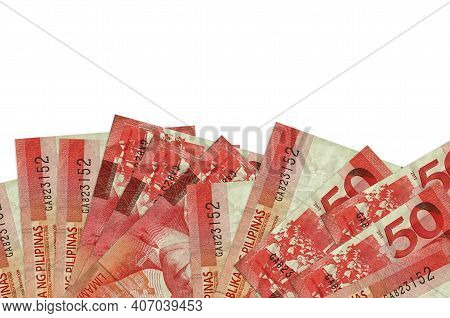 50 Philippine Piso Bills Lies On Bottom Side Of Screen Isolated On White Background With Copy Space.