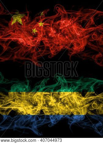 China, Chinese Vs Gabon, Gabonese, Gabonian Smoky Mystic Flags Placed Side By Side. Thick Colored Si