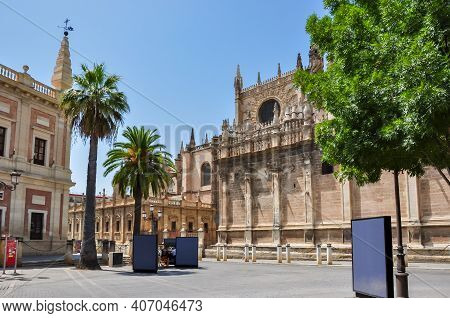 Archive Of The Indies (archivo General De Indias) And Seville Cathedral On Triumph Square, Spain