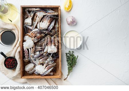 Fresh Raw Blue Swimming Crab Ocean Gourme Parts Set, In Wooden Box, On White Background, Top View Fl