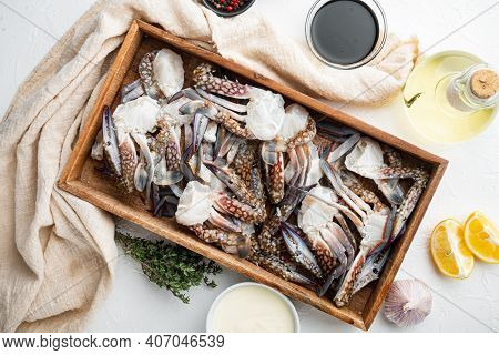 Fresh Raw Blue Swimming Crab Ocean Gourme Parts Set, In Wooden Box, On White Background, Top View Fl