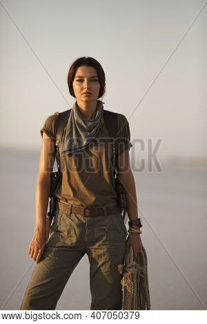 Adventurer Treasure Hunter With A Rope In Desert