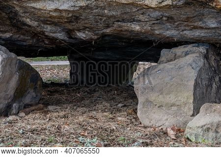 View Under A Dolmen Capstone Sitting On Smaller Boulders.