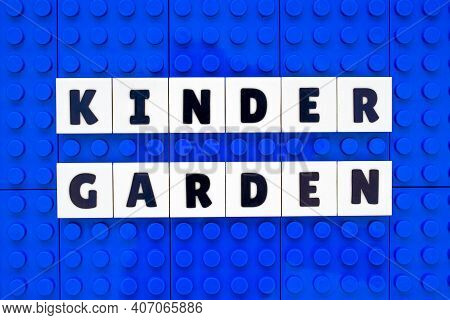 Kinder Garden Sign Text Build With Interlocking Plastic White And Blue Bricks