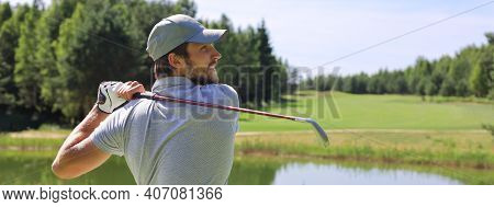Golfer Hits An Fairway Shot Towards The Club House.